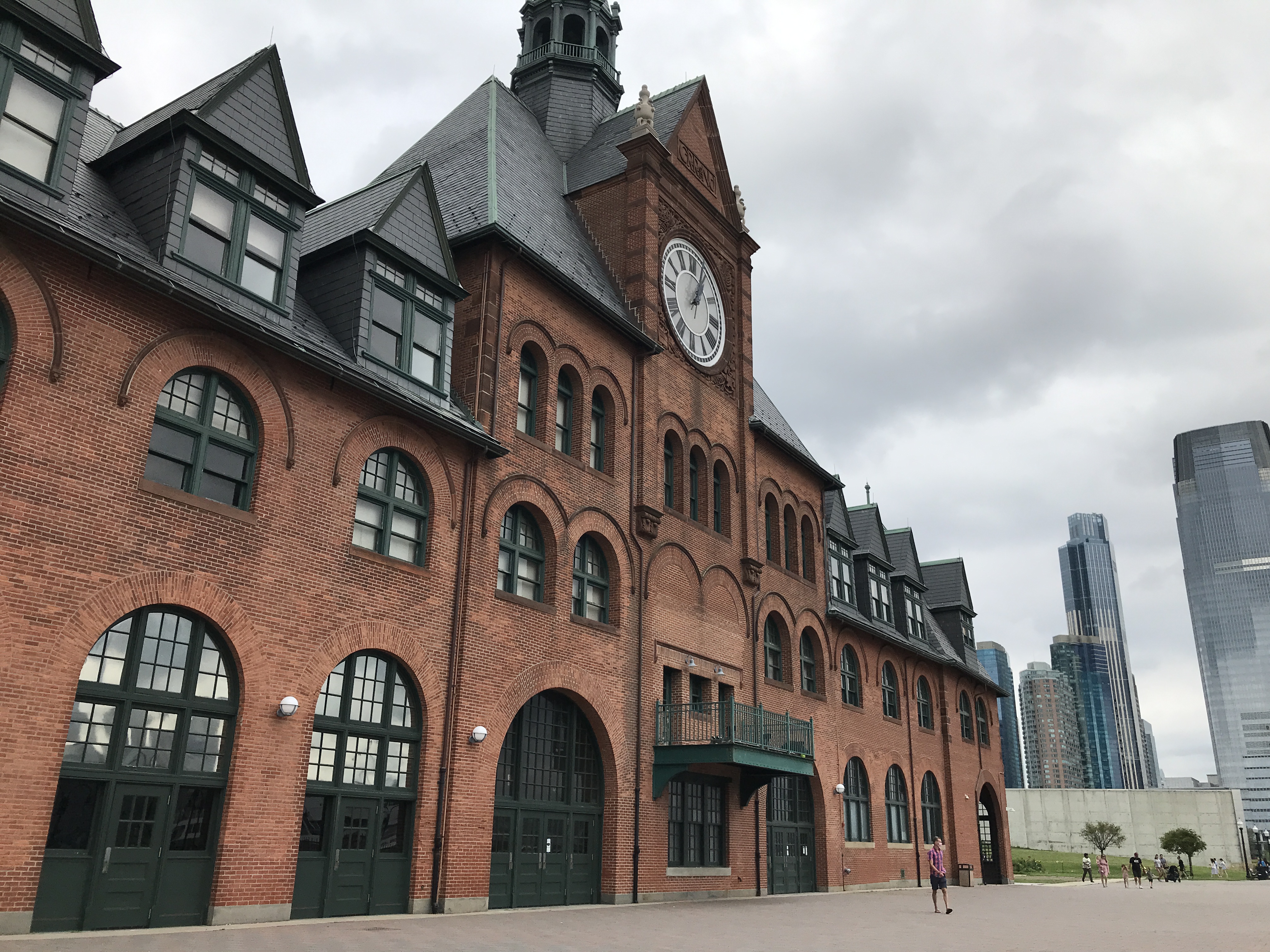 The dark red bricked building of the Central Railroad of New Jersey Terminal (CRRNJ). Sky is cloudy. Jersey City, New Jersey, United States