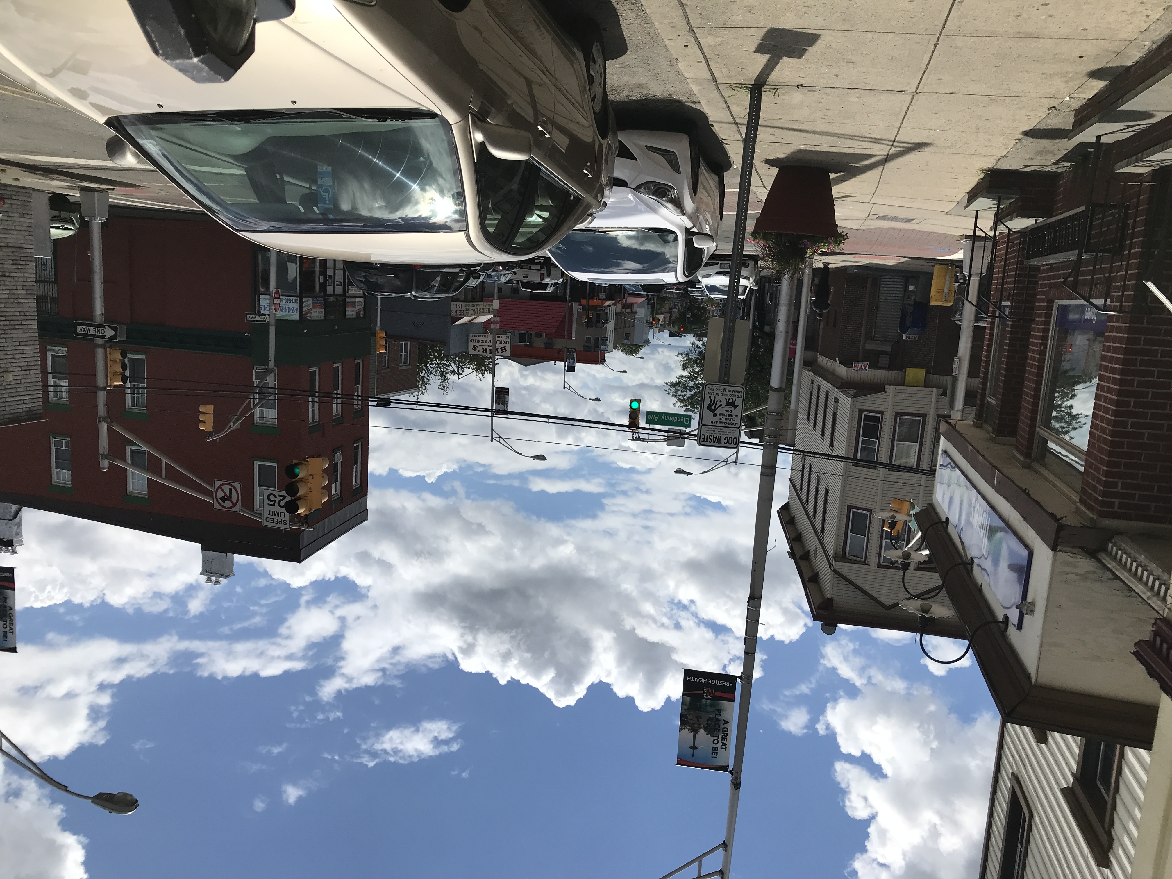 A partly cloudy sky over the businesses of West Side Avenue, Jersey City, New Jersey, United States of America