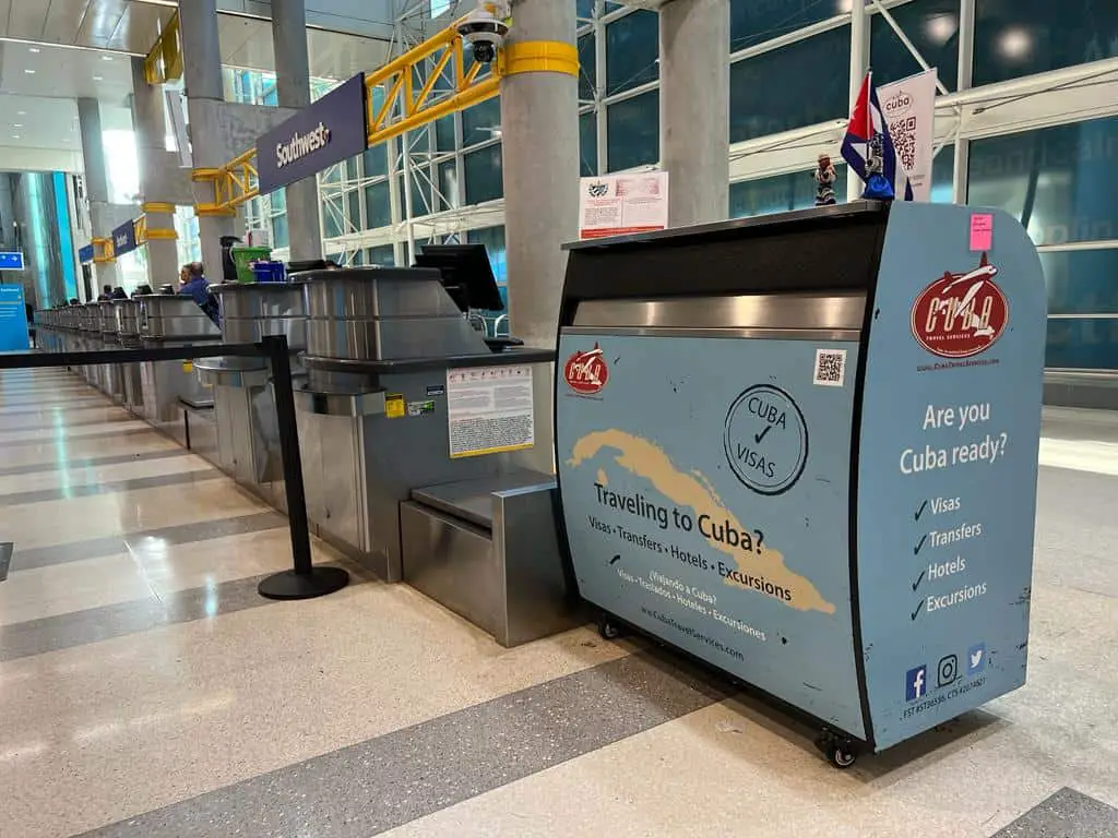 The light blue Cuba visa stand next to the Southwest check-in counter at Fort Lauderdale Airport.