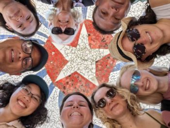 Meggie with seven other American citizens in a group photo in front of a Cuban flag mosaic in Fusterlandia in Havana, Cuba.
