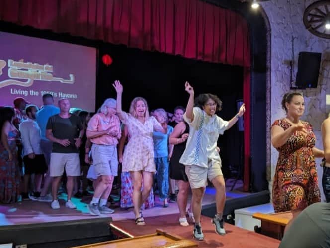 Meggie dancing on the red stage at the Buena Vista Social Club in Havana, Cuba.